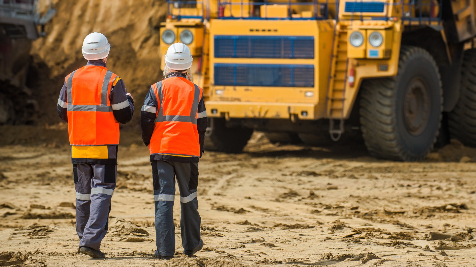 Man and woman working in an open-pit